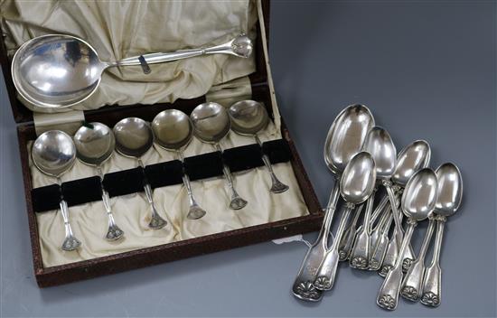 Eleven Tiffany & Co sterling silver fiddle and shell pattern teaspoons and a similar tablespoon and a cased plated dessert set,